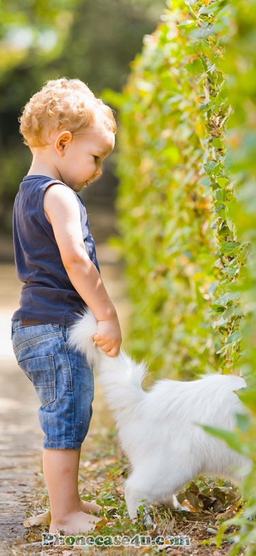 a cute kid and a white cat